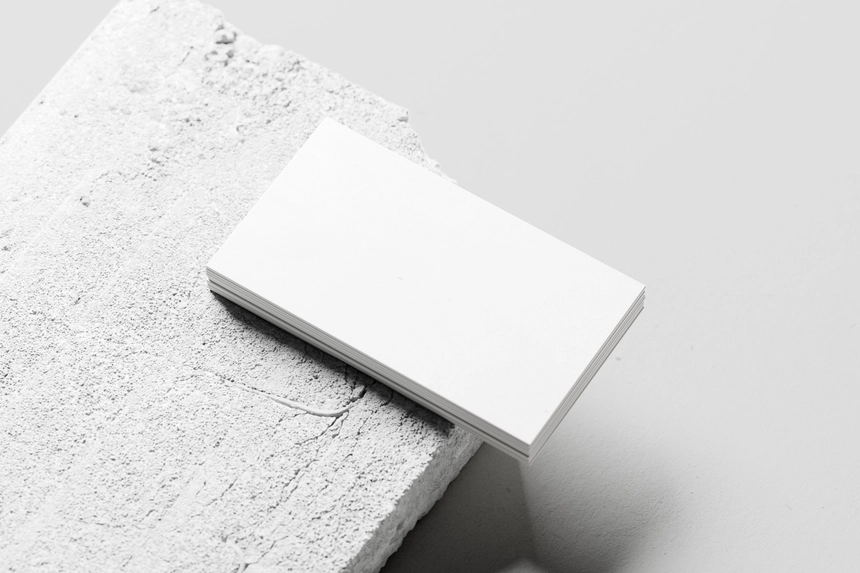 Free Business Card Mockup Stacked On Concrete