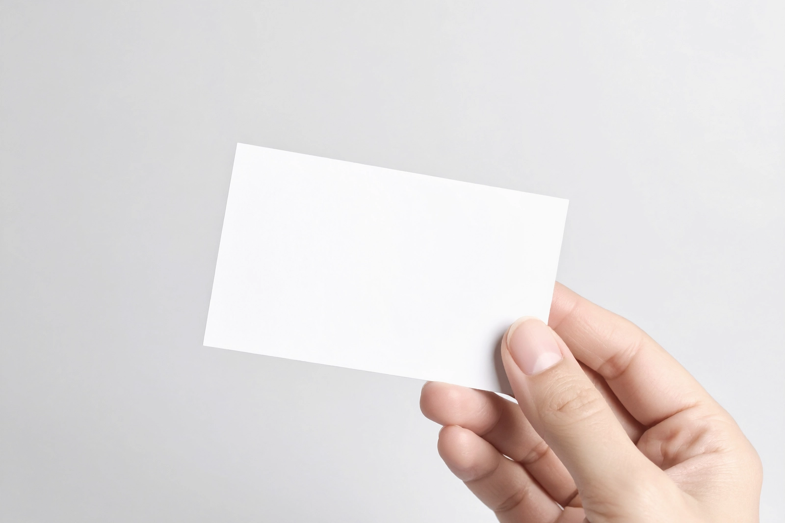Free Business Card Holding By Hand Mockup
