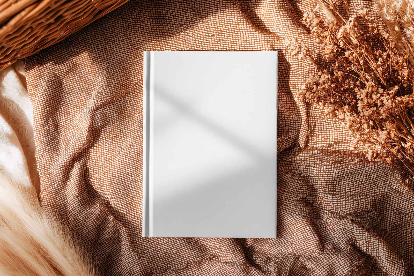Free Hardcover Book Mockup – Top View on Cozy Fabric Scene