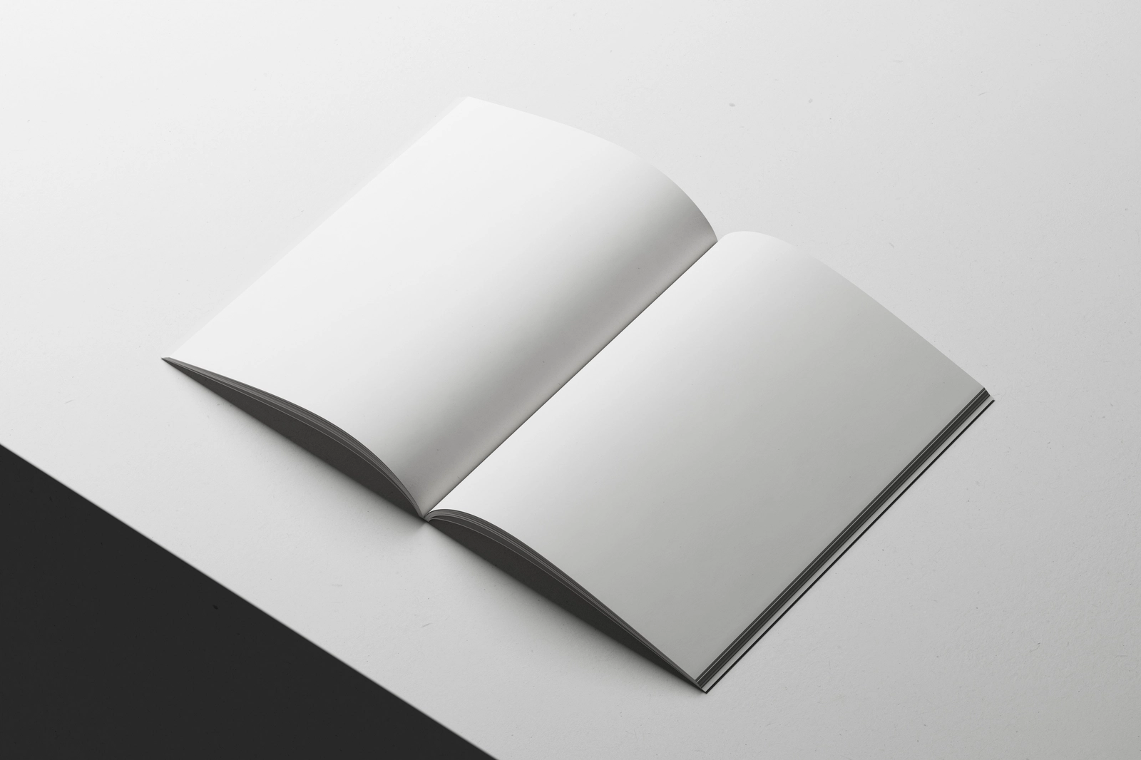 Free A4 Magazine Mockup Open on Minimal White Surface