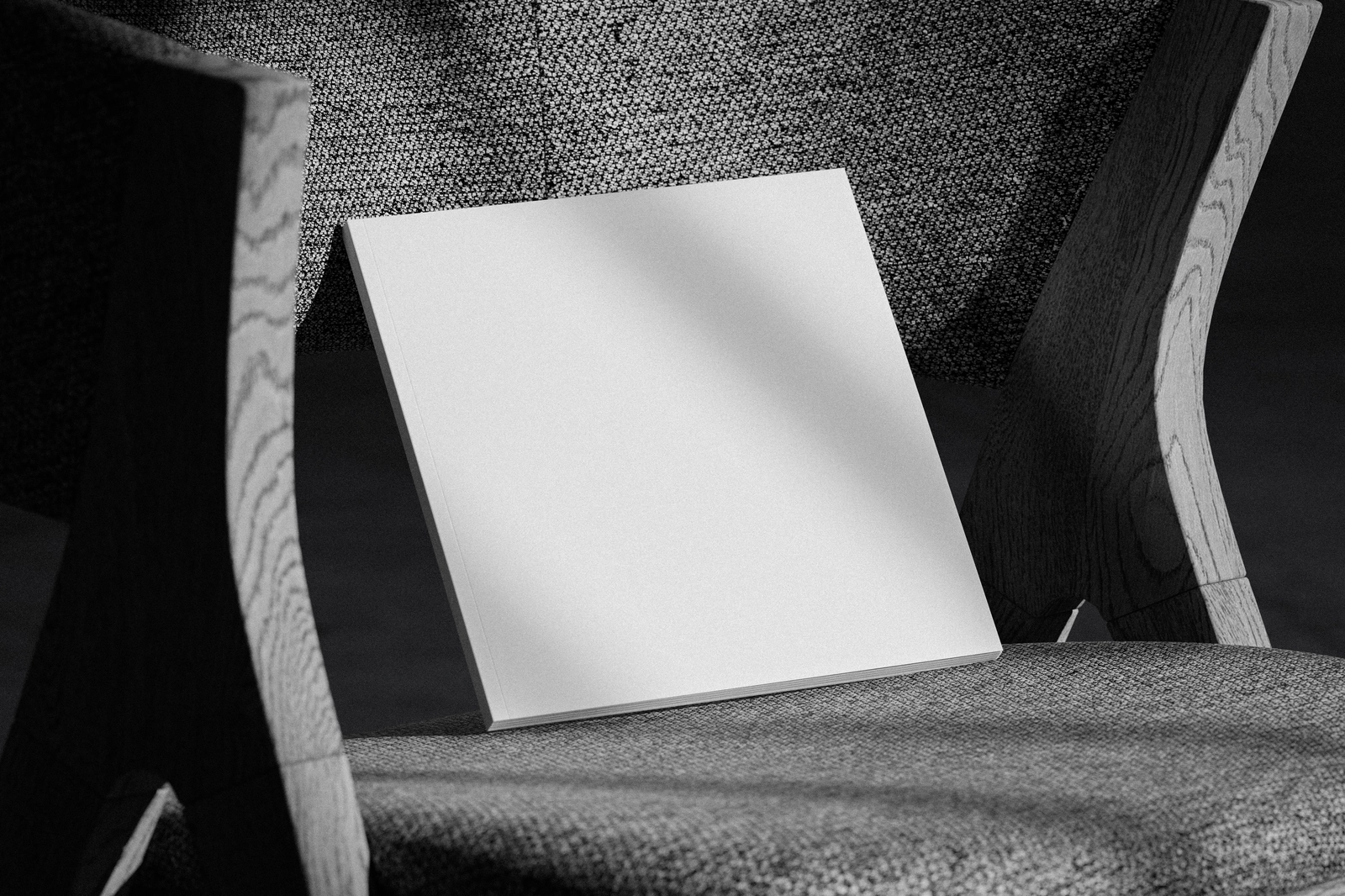 Free Square Magazine Cover Mockup on Textured Fabric Chair