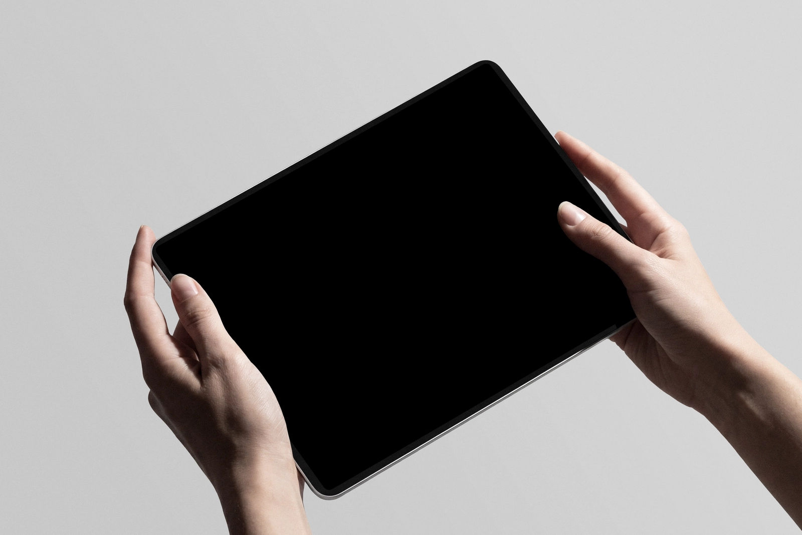 iPad Pro Holding By Hand Mockup