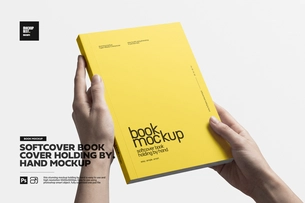 Softcover Portrait Book Holding By Hand Mockup