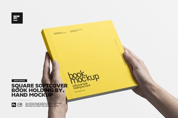 Square Softcover Book Holding By Hand Mockup